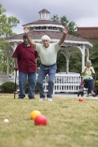 Two men playing Bocce Ball at Wesley Woods Newan